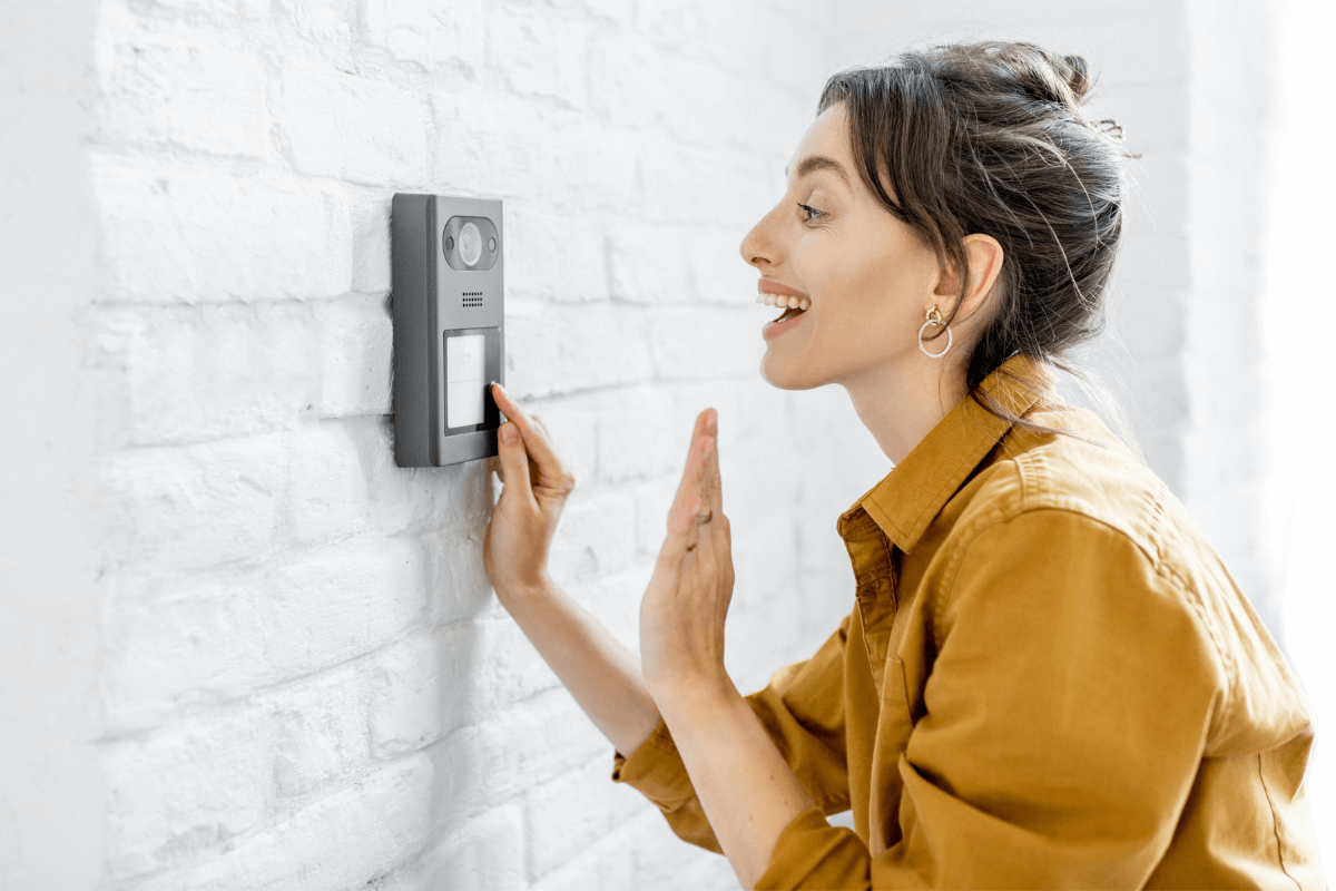 woman ringing video doorbell security